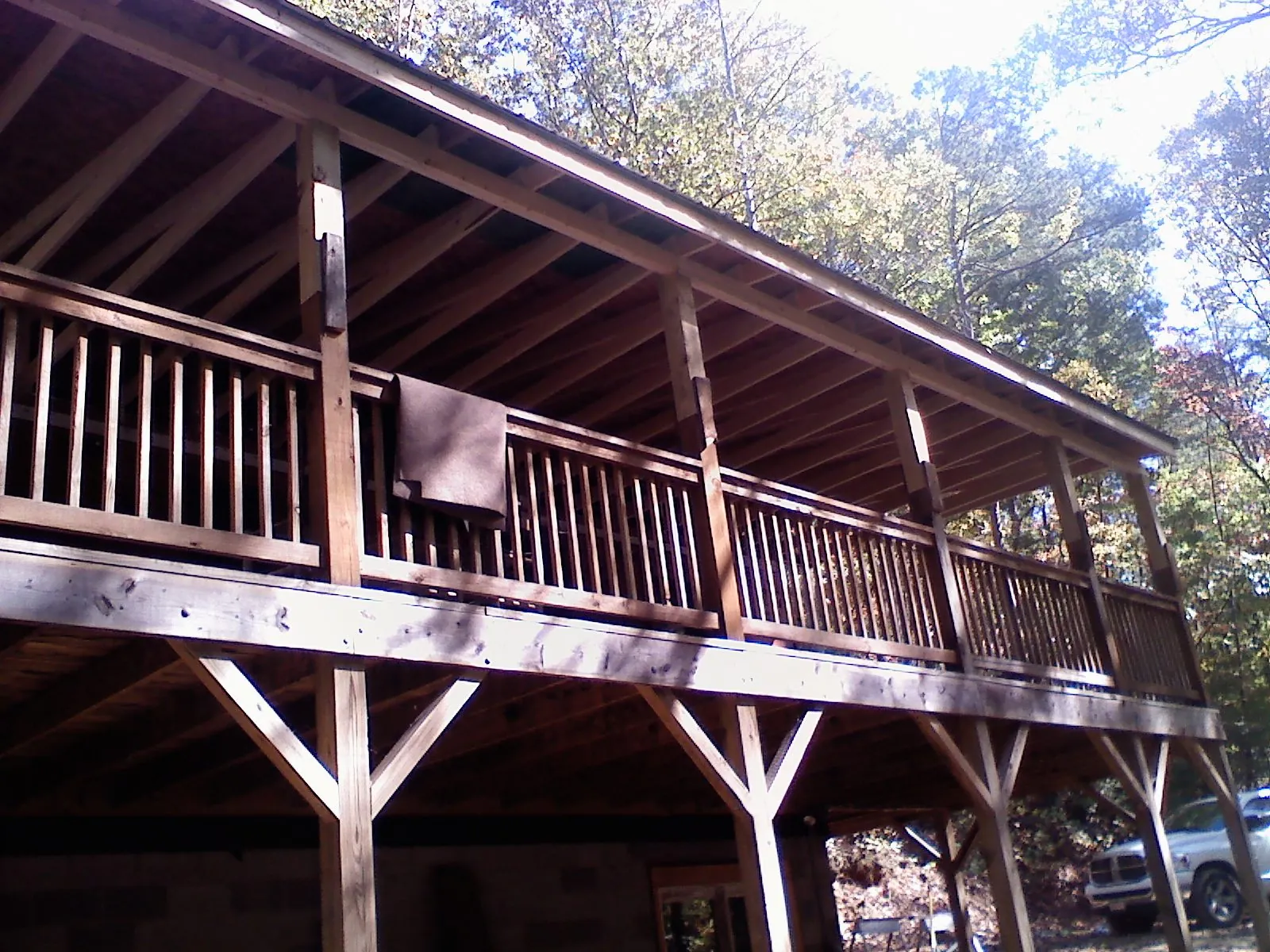 Timber framing under a new elevated porch and deck — Roof Leak Repair in Minetto by Roofing Brothers